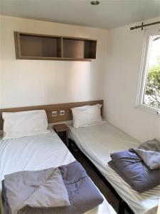 Campings Charmant mobil-home N°698 3ch tout confort au calme : photos des chambres