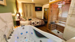 Appartements Votre Escale Jungle Sauna & Spa : photos des chambres