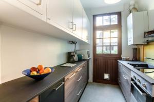 Appartements Le Monarque - Appartement avec jardin : photos des chambres