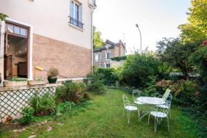 Appartements Le Monarque - Appartement avec jardin : photos des chambres