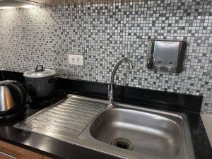 One Palm Tree Villas near NAIA Airport .