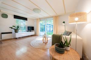 84, gelegen in het rustige & bosrijke Oisterwijk! Met privétuin