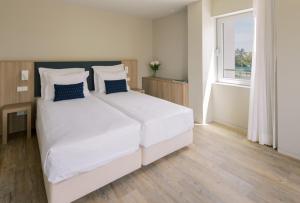 One-Bedroom Suite room in Aqualuz Troia Lagoa Hotel by The Editory