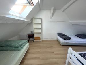 Appartements LIKEHOME - Appartement cosy et calme proche Paris : photos des chambres
