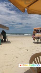 Apartamento na praia com estacionamento Pé na areia Guarujá