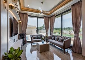 SaffronStays Nishta - 4BR pet-friendly villa with pool, turf, gazebo & terrace BBQ views in Alibaug