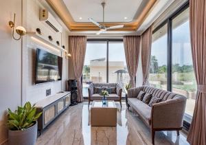 SaffronStays Nishta - 4BR pet-friendly villa with pool, turf, gazebo & terrace BBQ views in Alibaug