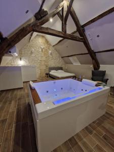 Appartements Suite Chalet avec jacuzzi. UrbanSpa60 : photos des chambres