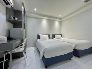 Phòng Hai Giường Đơn Tiêu Chuẩn không có Cửa Sổ (Standard Twin Room without Window)