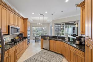 Home with poolspa, ping pong and steps to beachfood