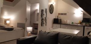 Appartements Guibert 19 studio combles wifi sweet home : photos des chambres