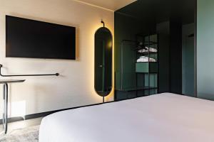 Hotels Novotel Paris Suresnes Longchamp : photos des chambres