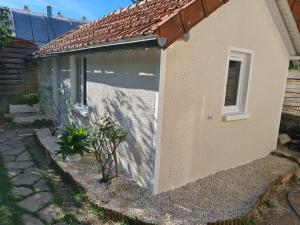 Appartements Petite maison cosy dans un jardin. : photos des chambres
