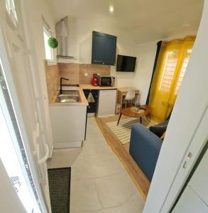 Appartements Petite maison cosy dans un jardin. : photos des chambres