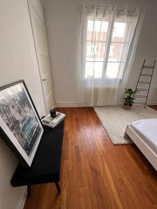 Appartements Somptueux T3 Coeur de ville avec Balcon : photos des chambres