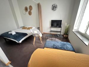Appartements Mon Spacieux Studio Parking Un-Sejour-a-Part : photos des chambres