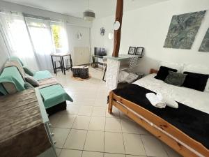 Appartements Vue sur Jardin Parking Ascenseur Un-Sejour-a-Part : photos des chambres