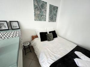 Appartements Vue sur Jardin Parking Ascenseur Un-Sejour-a-Part : photos des chambres