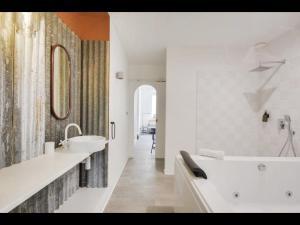 Appartements Les cachettes de Leon - Avec Jacuzzi : photos des chambres