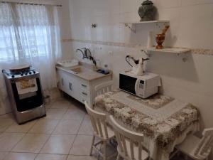 Casa de frente para o mar, pé na areia.