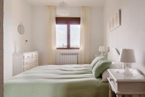 Casa de Las Flores - Apartamento con jardín privado frente a la Playa de Comillas