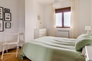 Casa de Las Flores - Apartamento con jardín privado frente a la Playa de Comillas