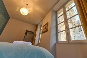 Appartements Appartement Montagnon - les suites du palais - Classe 4 etoiles, parking prive, vue cathedrale, 3 chambres, PRIMO C0NCIERGERIE : photos des chambres