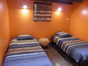 Les Gites du Monde , Appartements 2 chambres- 4 lits simples modulables en lits doubles : photos des chambres