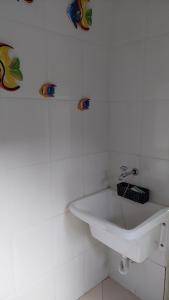 Casa aconchegante com ar condicionado para família em condomínio