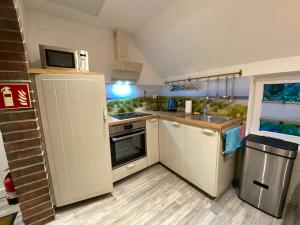 Ferienwohnung Gulfhaus, mit Sauna und großem Garten