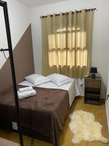 Casa aconchegante à 400m da Praia da Tartaruga - Ar condicionado - WIFI 450MB - Netflix - Cozinha Completa - Garagem