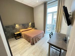 Hotels Hotel de La Comedie : photos des chambres