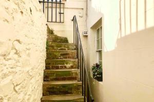 Beachfront apartment with wood burner & courtyard
