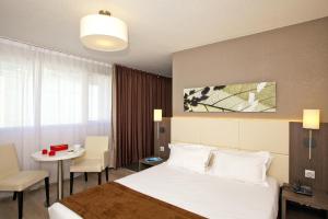 Appart'hotels Sejours & Affaires Courbevoie Grande Arche : photos des chambres