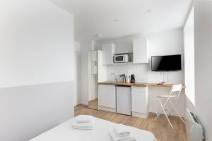 Appartements Paimpont - Agreable studio neuf, 5 min tramway, tout equipe, proche centre : photos des chambres