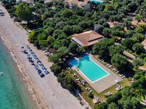 Pebbles and sea at Barbati with shared pool