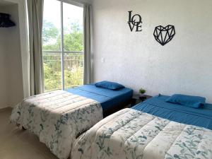 Departamento 2 habitaciones vista a la alberca Nube by EITA