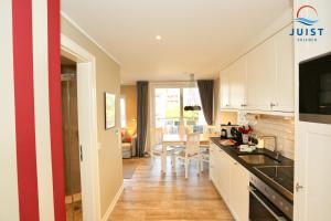 Haus Achterhus 213 - Wohnung 13 "rote Krabbe"