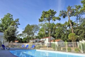 Maisons de vacances La Rose des Pins - 4 personnes - Proche de la mer avec piscine commune : photos des chambres