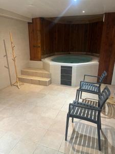 Appartements La Grange Auguste avec Sauna Jacuzzi : photos des chambres