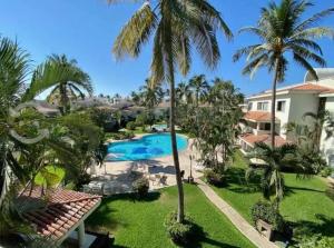 Hermoso apartamento en Manzanillo con alberca y cancha de tenis, Ideal para relajarse y disfrutar de una escapada tranquila en el paraíso tropical
