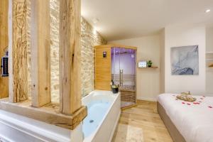 Appartements Le Petit Paris - Cocon & Spa & Sauna : photos des chambres