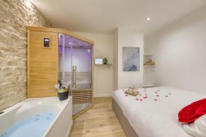 Appartements Le Petit Paris - Cocon & Spa & Sauna : photos des chambres