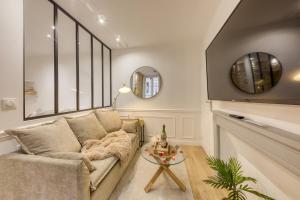 Appartements Le Petit Paris - Cocon & Spa & Sauna : photos des chambres