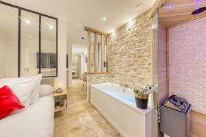 Appartements Le Petit Paris - Cocon & Spa & Sauna : photos des chambres