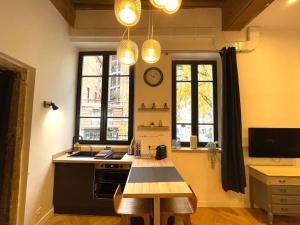 Appartements Logement de charme avec balneo : photos des chambres