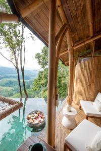 Cliffside Bamboo Treehouse with Heated Pool and View