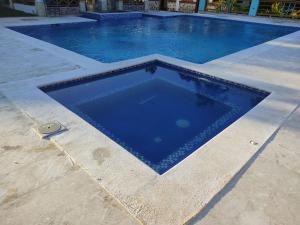 Villa Carolina By Hospedify Hermosa villa con piscina, mesa de billar, cancha de baloncesto y BBQ