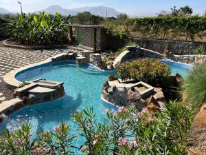 SaffronStays Lake House Bouganvillea, Nashik - rustic pool villa with great lake views and patio dining