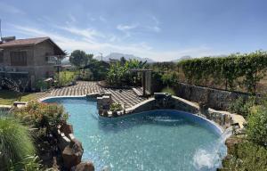 SaffronStays Lake House Bouganvillea, Nashik - rustic pool villa with great lake views and patio dining